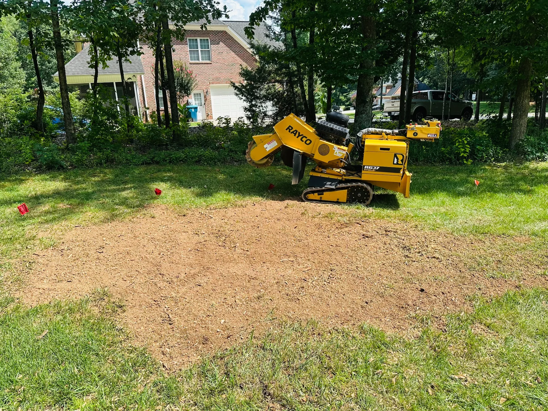 Completed stump grinding area after removal by Iron Oak Landworks